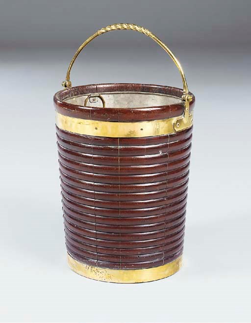 AN IRISH BRASS-BOUND MAHOGANY PEAT BUCKET