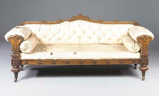 AN IRISH EARLY VICTORIAN OAK SOFA