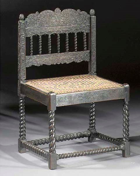 A Dutch colonial ebony and ebonised chair