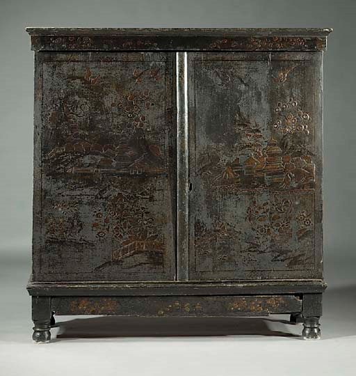 A Dutch gilt and black-japanned cupboard