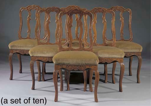 A set of ten German oak dining-chairs