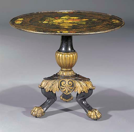 A North European parcel-gilt, black-painted and polychrome-decorated iron table