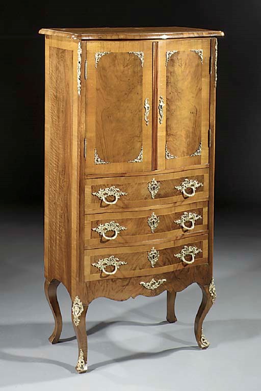 A German ormolu-mounted walnut and figured walnut small cabinet