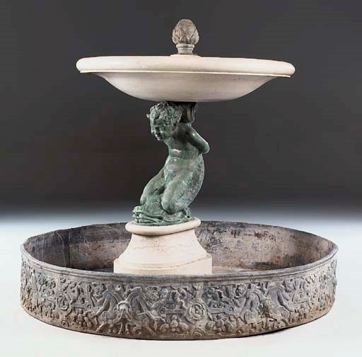 A marble and bronze fountain with lead waterbasin