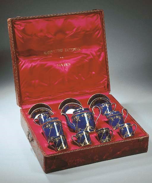 A Sèvres porcelain troisième république gilt blue coffee service in a fitted case