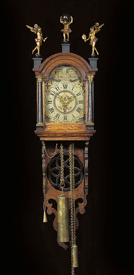 A Frisian oak and ebonised wallclock 'staart schippertje'