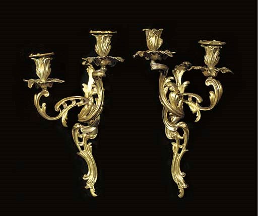 A pair of ormolu two-light appliques