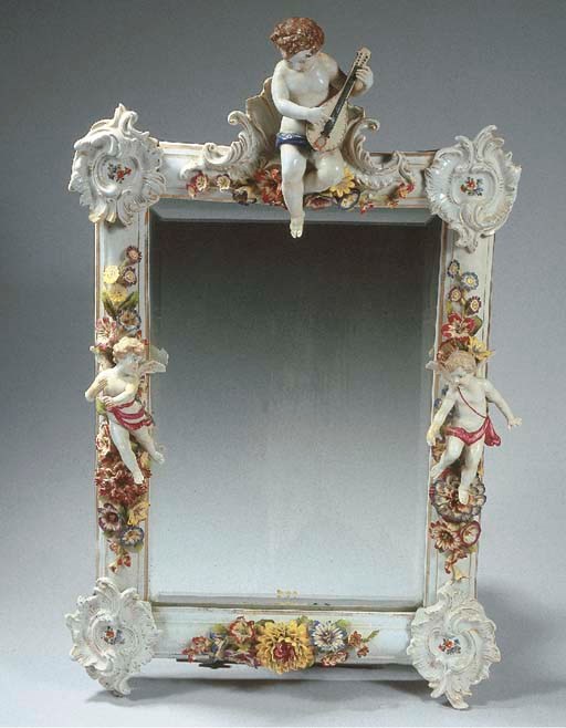 A Saxon porcelain rectangular mirror frame