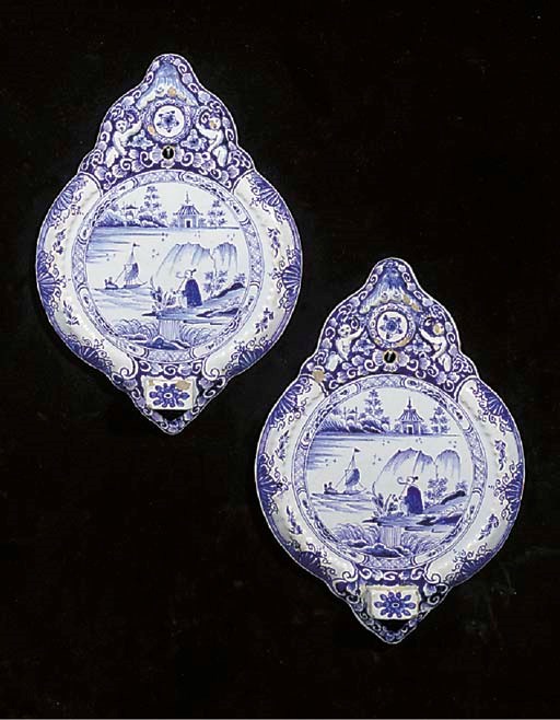 A pair of Dutch Delft blue and white chinoiserie wall sconces