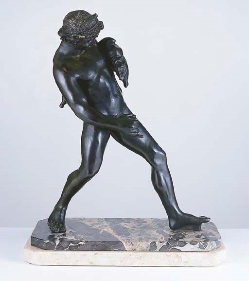 A BRONZE FIGURE OF A FAUN WITH A WINE SACK