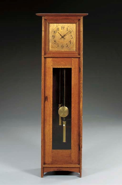 AN OAK TALL CASE CLOCK