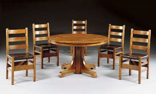 AN OAK DINING TABLE AND FIVE DINING CHAIRS