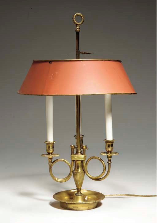 A LOUIS XVI STYLE LACQUERED BRASS THREE-LIGHT BOUILLOTTE LAMP,