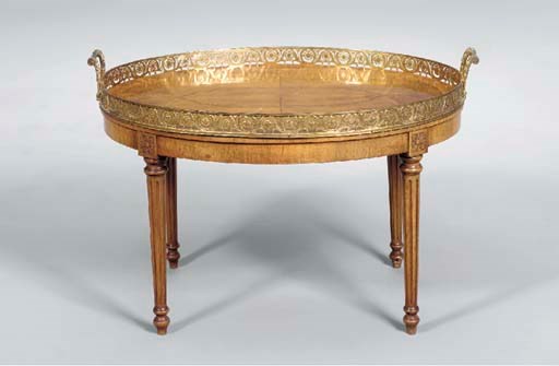 A LOUIS XVI STYLE ORMOLU-MOUNTED WALNUT LOW TABLE,