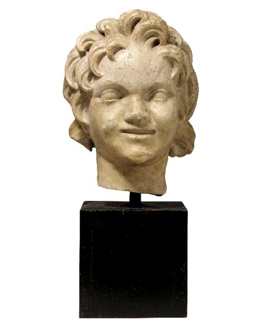 A ROMAN STYLE MARBLE HEAD OF A YOUNG SATYR,