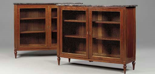 A PAIR OF LOUIS XVI BRASS-MOUNTED MAHOGANY BIBLIOTHEQUES,
