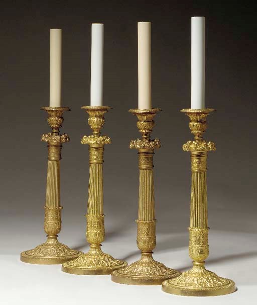 A SET OF FOUR LOUIS PHILIPPE STYLE ORMOLU CANDLESTICKS MOUNTED AS TABLE LAMPS,