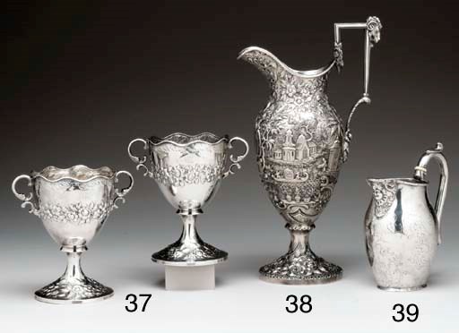 A SILVER ARCHITECTURAL WATER EWER