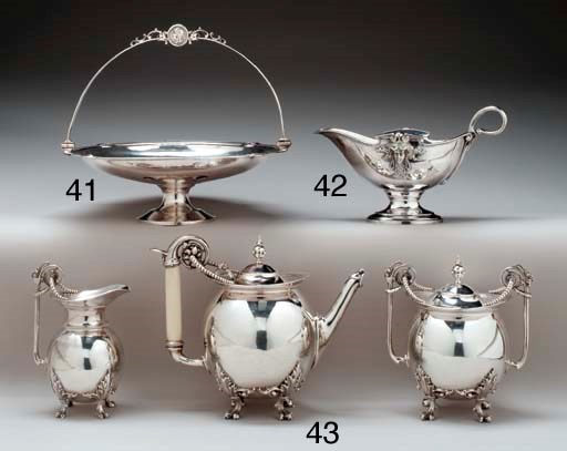 A SILVER THREE-PIECE TEA SERVICE**