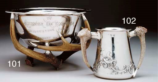 A SILVER LOVING CUP WITH HORN HANDLES
