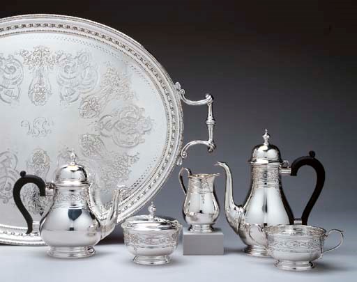 A SILVER FIVE-PIECE TEA AND COFFEE SERVICE WITH SILVER-PLATED TRAY