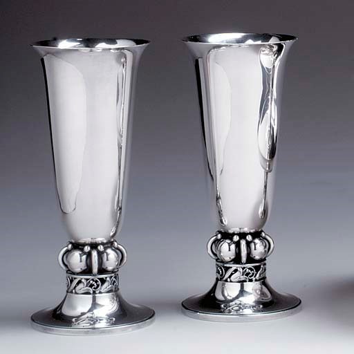 A PAIR OF SILVER VASES