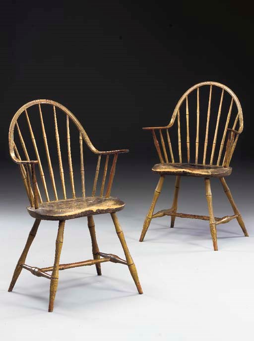 A PAIR OF YELLOW-PAINTED CONTINUOUS ARM WINDSOR CHAIRS