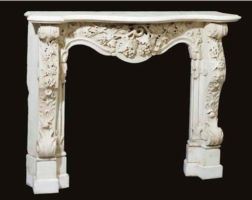 A Rococo style carved white marble chimney-piece