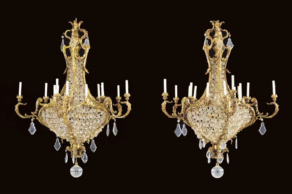 A pair of Rococo style ormolu and cut glass fifteen-light chandeliers