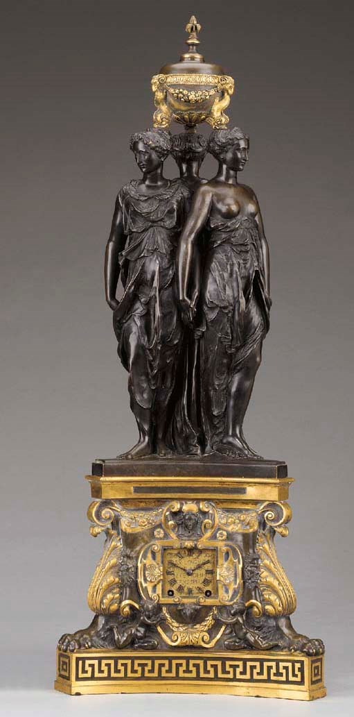 A French Neoclassic style parcel gilt and patinated bronze figural clock