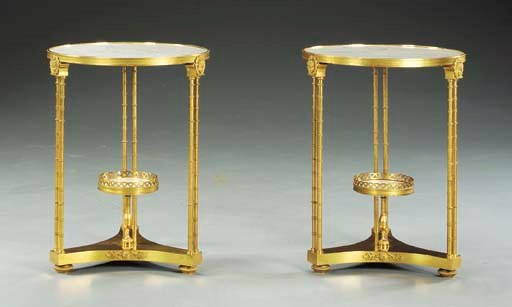 A pair of Louis XVI style ormolu and white marble gueridons 'a double colonnettes'