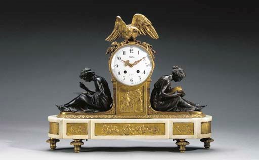 A Louis XVI style ormolu, patinated bronze and white marble mantel clock