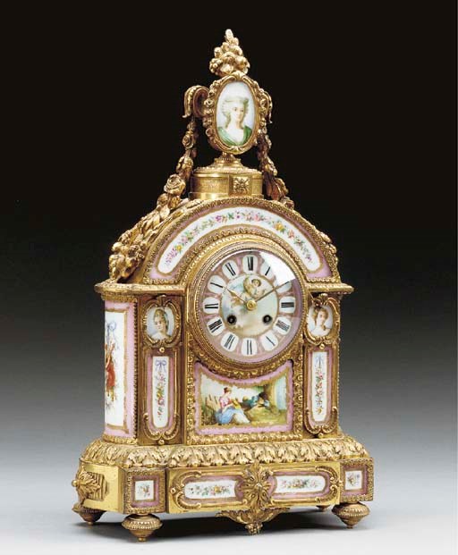 A Louis XVI style ormolu and Sevres-style porcelain mantel clock