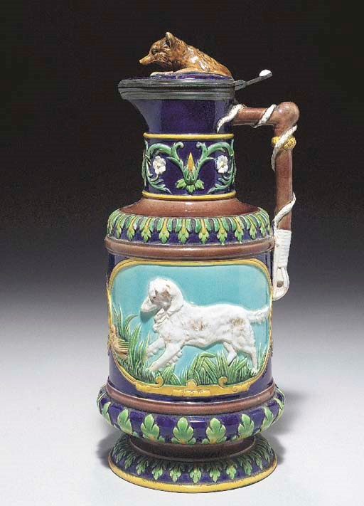 A PEWTER-MOUNTED GEORGE JONES MAJOLICA 'HUNTING' BEER JUG AND COVER