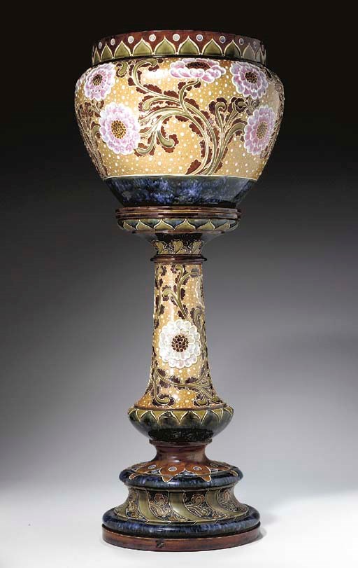 A DOULTON LAMBETH STONEWARE JARDINIÈRE AND PEDESTAL