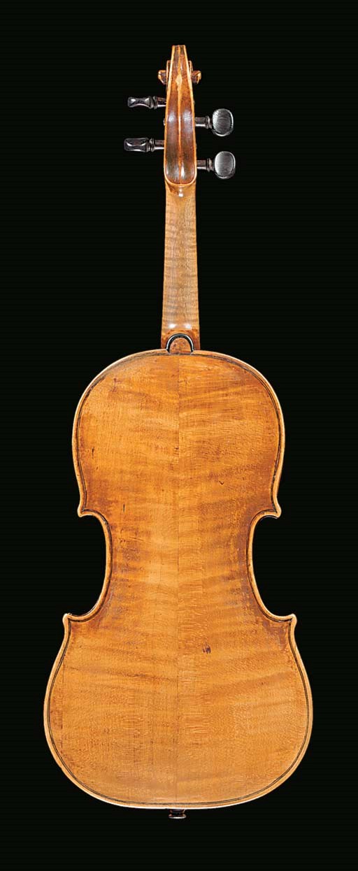 An interesting violin, possibly Venetian, labelled Antonius Stradiuarius Cremonensis, Faciebat Anno 17**, the two-piece back of medium to broad curl ascending from the centre joint, the ribs similar, the head of faint narrow curl, the table of fine grain in the centre opening out towards the flanks, the varnish of a golden-brown colour, the length of back 13 15/16in. (355mm)