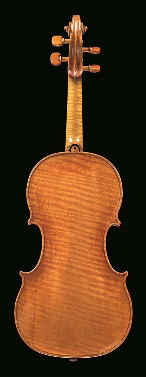 An 18th century Dutch violin, bearing an illegible label, the one-piece back of medium curl, the varnish of a golden-brown colour, the length of back 13 15/16in. (354mm)