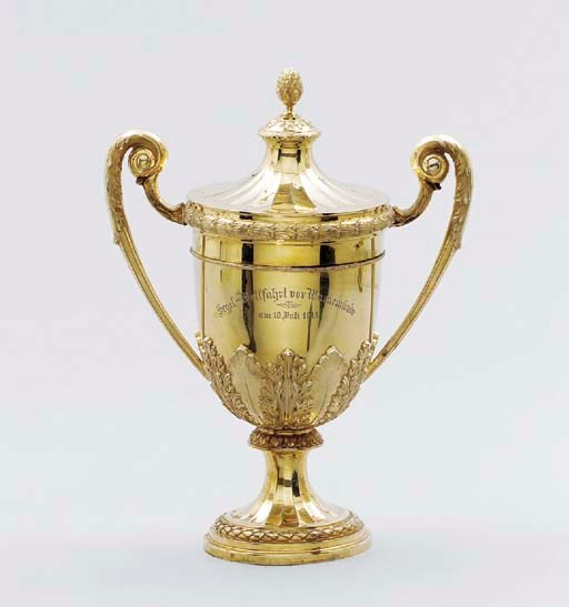 A German parcel-gilt yachting trophy in the form of a cup and cover