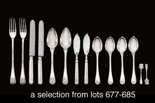 Twelve German silver table-knives and a butter-knife