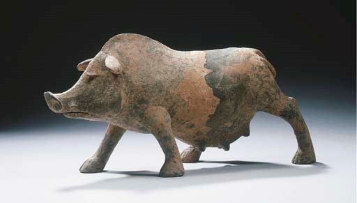 A grey pottery figure of a pig