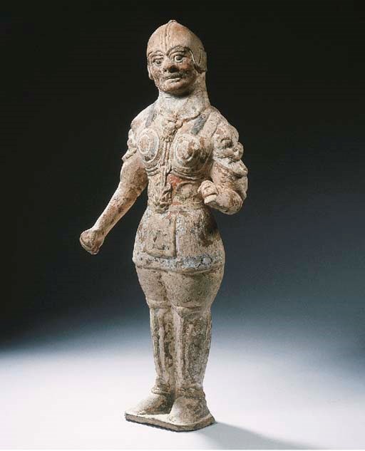 A red pottery figure of a lokapala