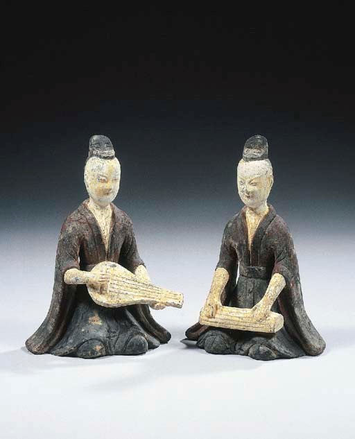 Two grey pottery figures of musicians