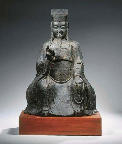 A bronze figure of a dignitary