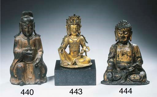 A gilt bronze figure of Guanyin