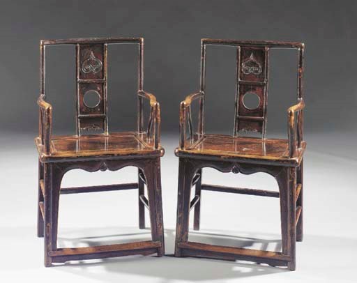 A pair of lacquered armchairs