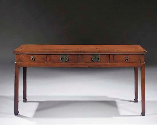 A wide red lacquer side table with four drawers