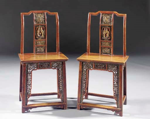 A pair of lacquered yokeback chairs