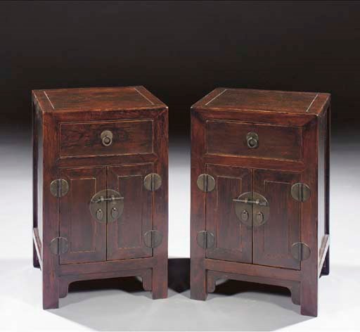 A pair of black lacquered side cabinets