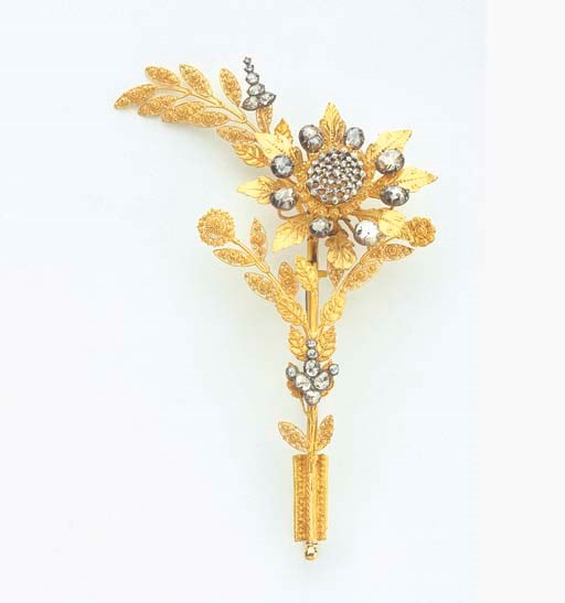 AN UNUSUAL ANTIQUE DIAMOND GOLD AND ROSE CUT DIAMOND EN TREMBLANT FLOWER BROOCH