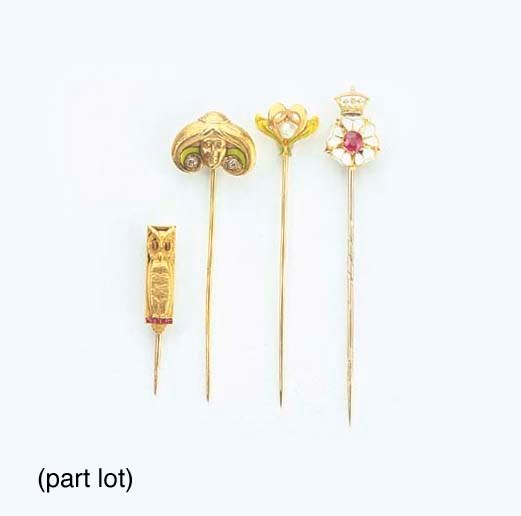 A COLLECTION OF TWELVE ANTIQUE GOLD AND GEM-SET TIE PINS